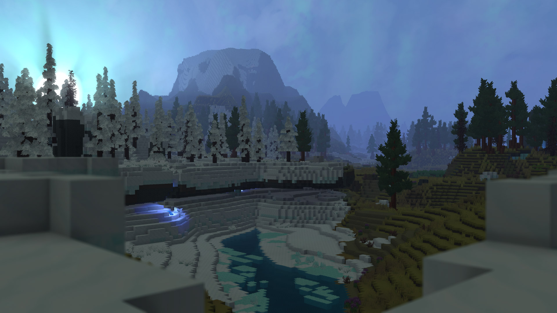 Пейзаж Зоны 3 Бореи (Zone 3 Borea) со снежными горами, замёрзшей рекой и водопадом, сосновыми лесами и туманным небом